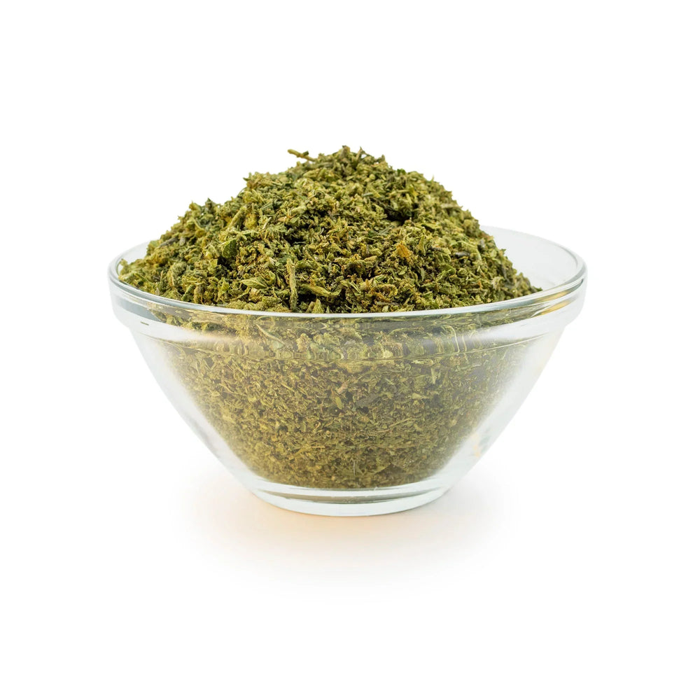 Small glass bowl of CBD biomass